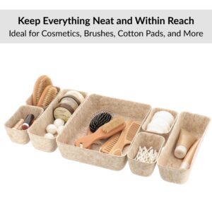 Beige felt drawer organizers holding brushes cosmetics and accessories