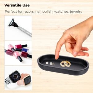 Black oval tray used for jewelry watches razors nail polish