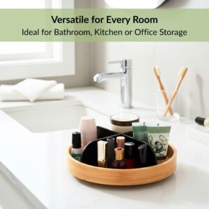 Bamboo rotating organizer with black dividers holding toiletries on bathroom vanity