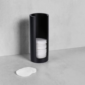 Black cotton pad holder with pads on counter