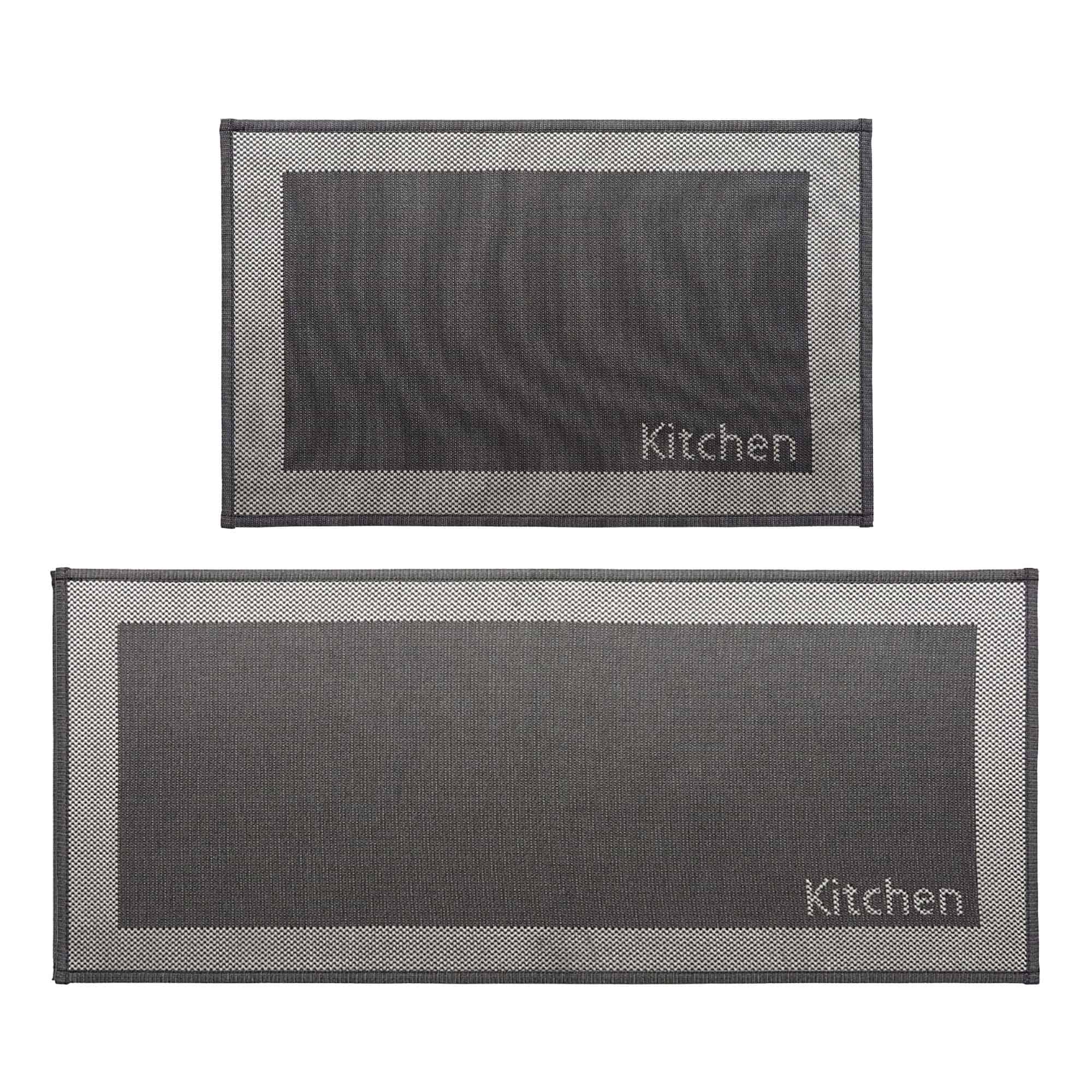 1- Two piece charcoal and cream bordered kitchen rug set with woven Kitchen word, mat and runner on white background