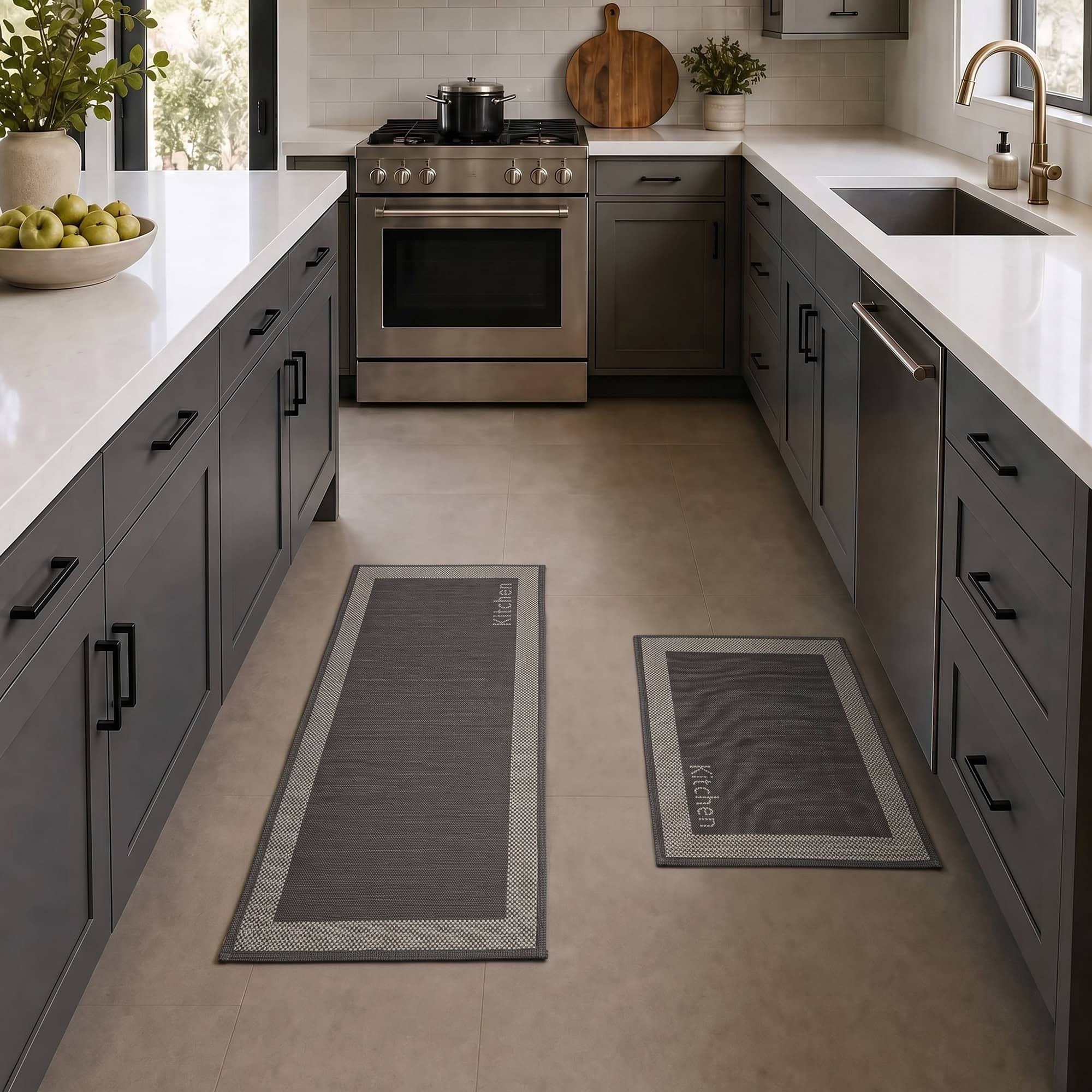 2- Charcoal and cream bordered kitchen mat and runner set with Kitchen word on tile floor in a gray kitchen