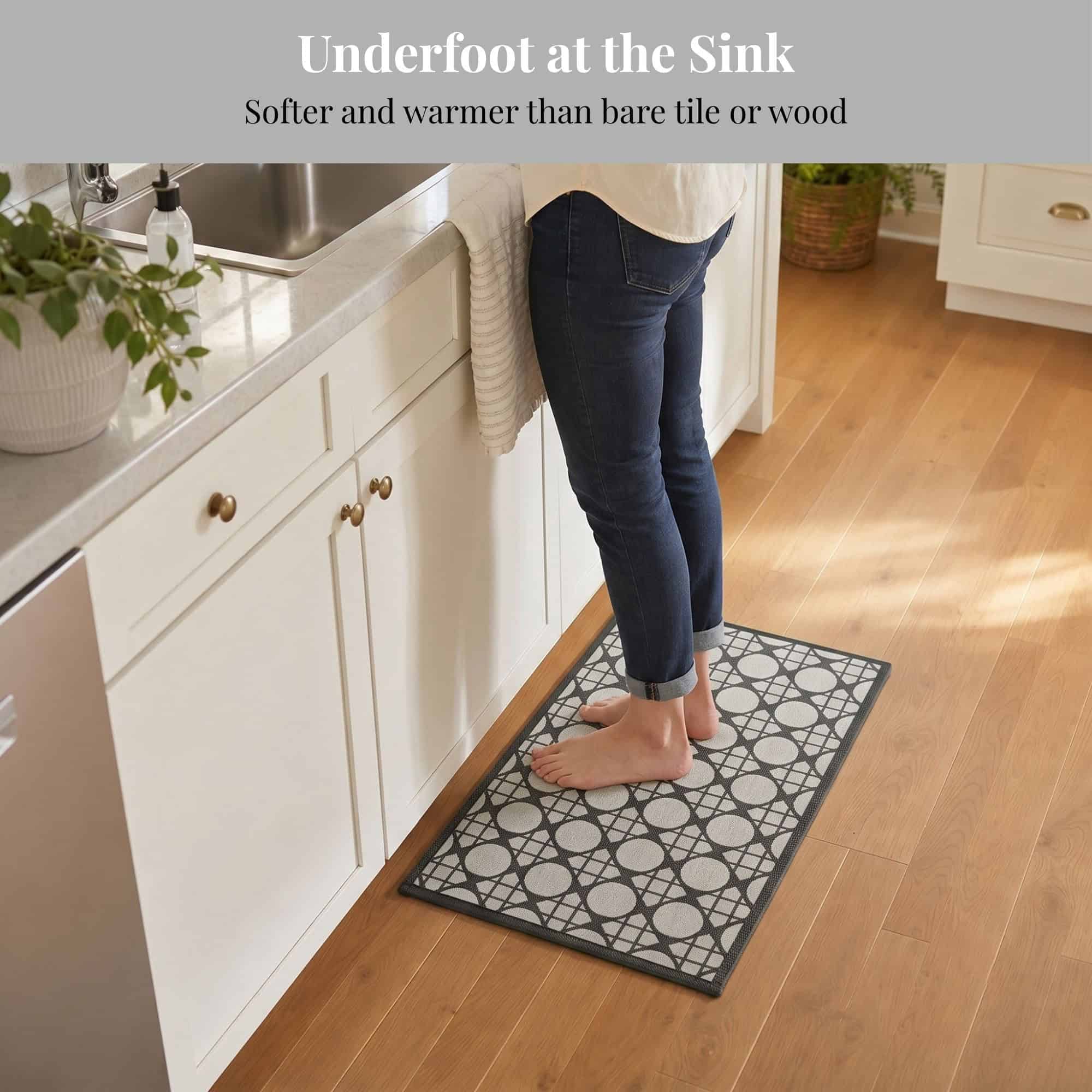 3- Barefoot person standing on cream and charcoal kitchen mat at the sink, cushioned underfoot on hardwood floor
