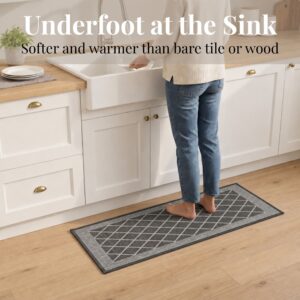 3- Barefoot person standing on charcoal gray diamond trellis kitchen runner at the sink, cushioned on wood floor