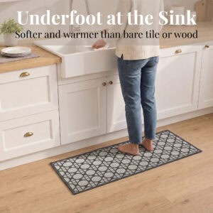 3- Barefoot person standing on cream and charcoal cane circle kitchen runner at the sink, cushioned on wood floor