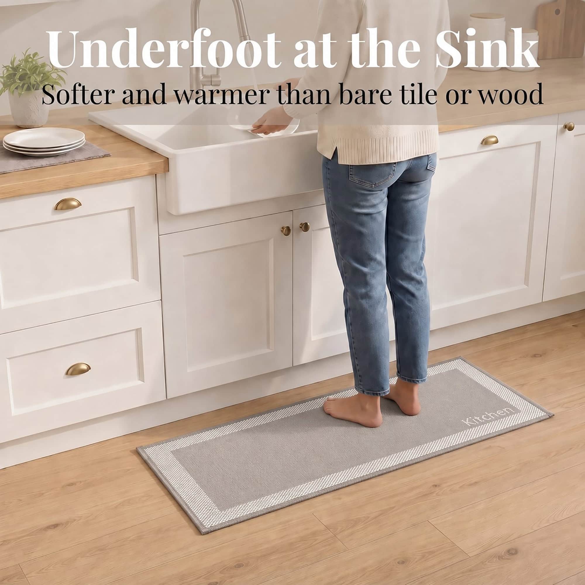 3- Person standing barefoot on taupe kitchen runner at the sink, softer underfoot than tile or wood