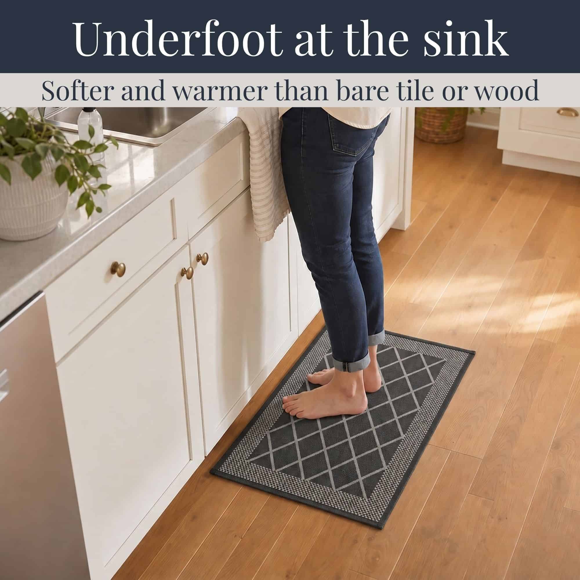 3- Barefoot person standing on charcoal gray diamond kitchen mat at the sink, cushioned on hardwood floor