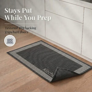 4- Charcoal kitchen mat with cream border and corner folded back to show textured TPR backing that grips hard floors