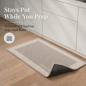 4- Taupe kitchen mat with cream border and corner folded back to show textured TPR backing that grips hard floors