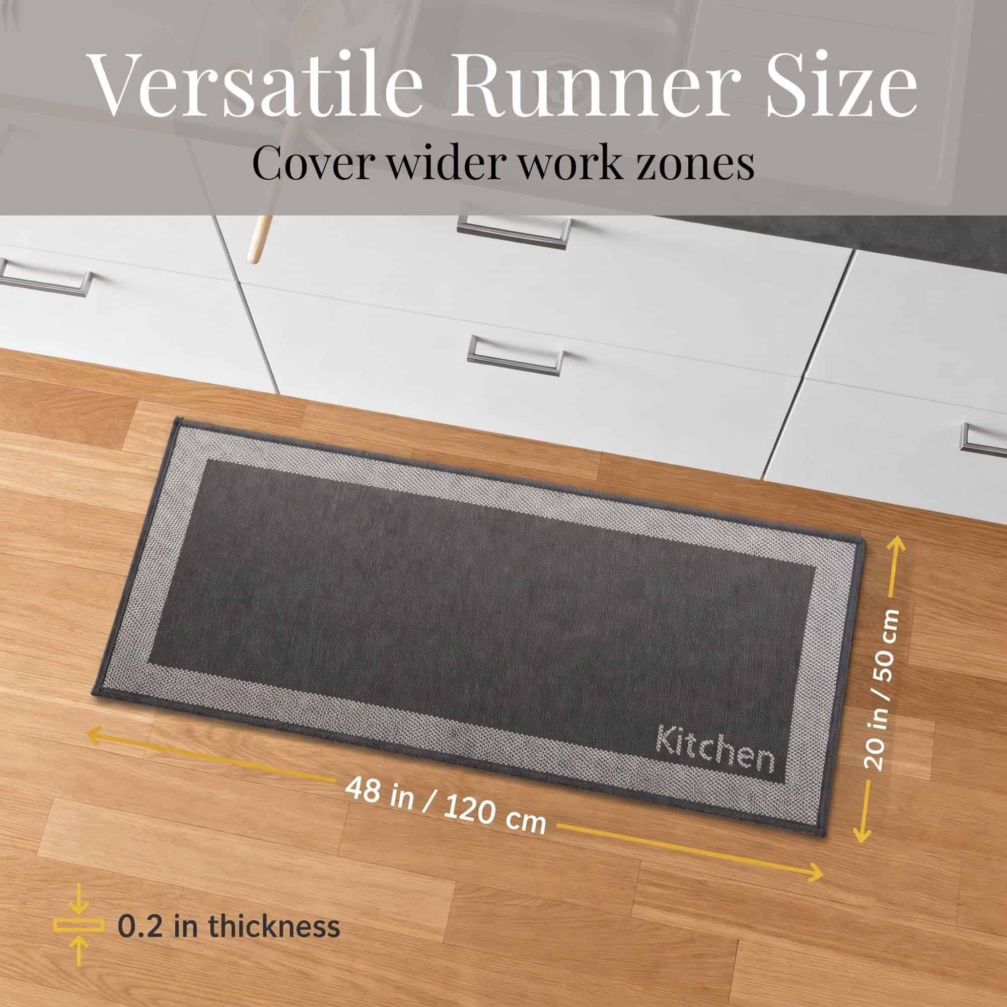 5- Charcoal and cream bordered kitchen runner with Kitchen word on wood floor, 48 by 20 inches for wider work zones