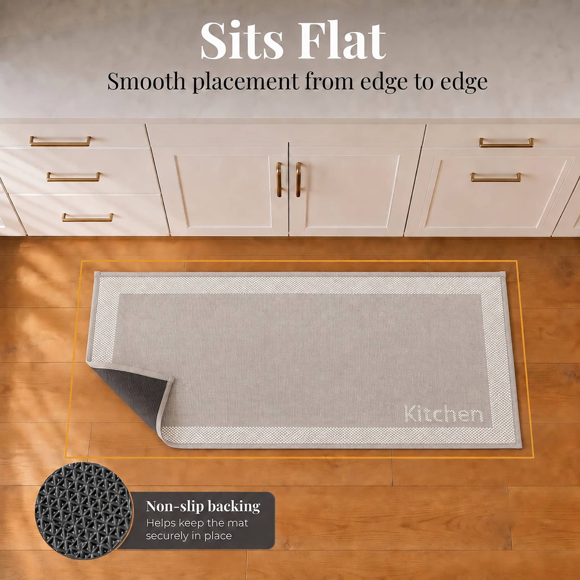 6- Taupe and cream kitchen runner with Kitchen word lying flat, corner folded to show non slip backing on wood floor