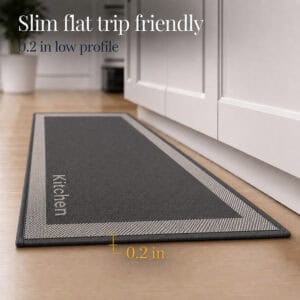 6- Low profile charcoal kitchen runner with cream border and woven Kitchen word, 0.2 inch thin, on wood floor