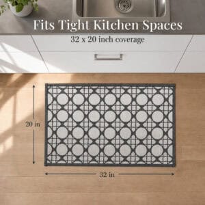 8- Top view of cream and charcoal cane circle kitchen mat measuring 32 by 20 inches placed at the sink