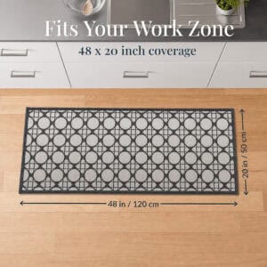 8- Cream and charcoal cane circle kitchen runner at the sink, 48 by 20 inches, sized to fit the work zone