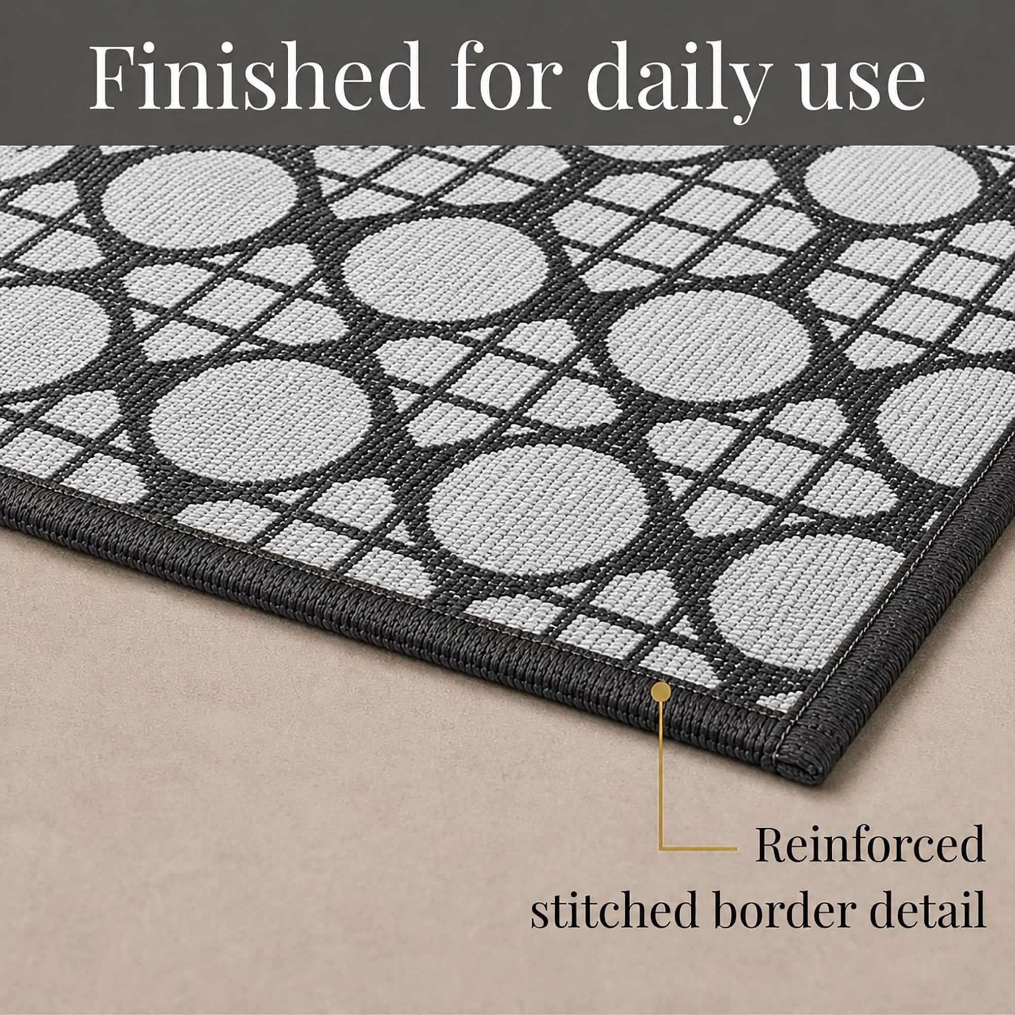 9- Close-up of cream and charcoal cane circle kitchen runner corner with reinforced stitched border detail