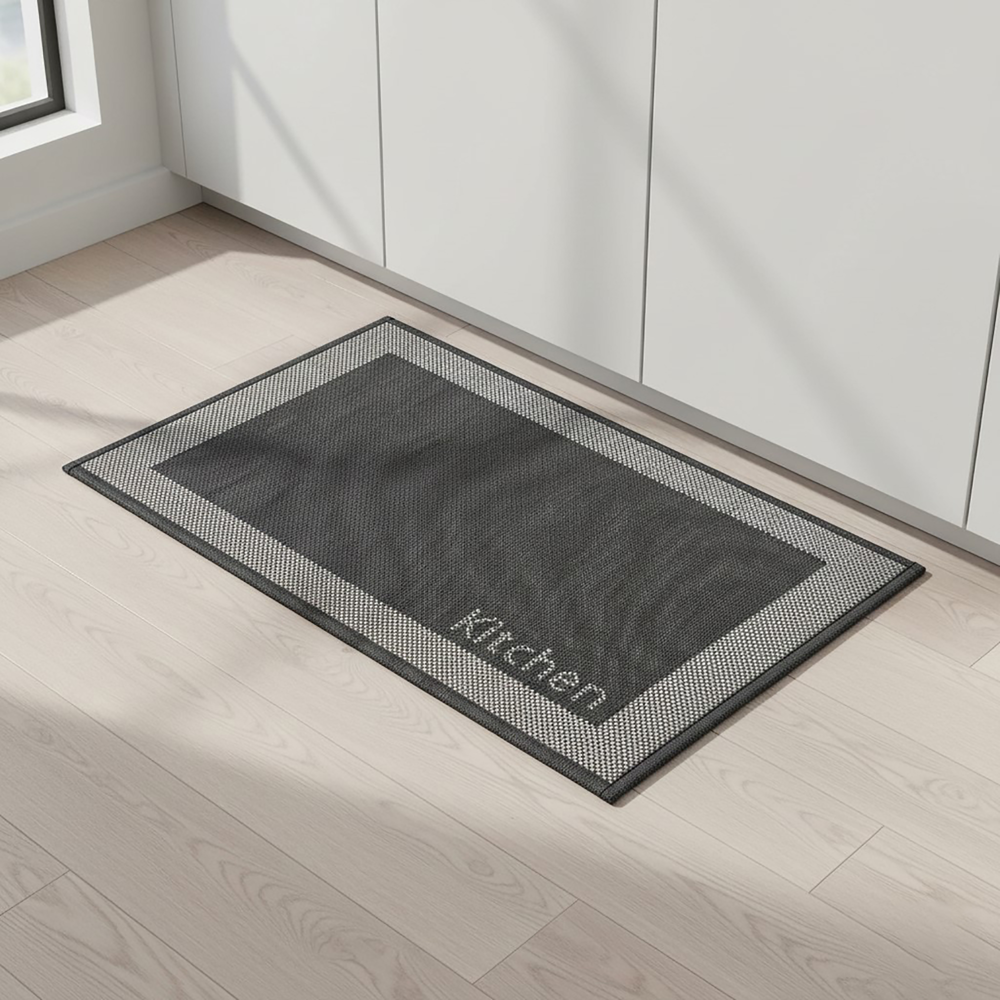 Black kitchen mat displayed in bright modern kitchen space