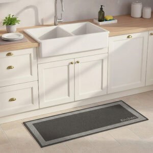 Kitchen black mat with border displayed in sunlit farmhouse kitchen