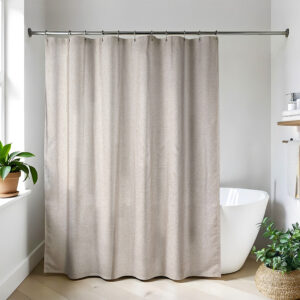 Taupe linen-look shower curtain hanging in bright bathroom
