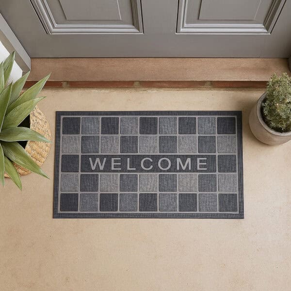 Gray welcome mat at doorway top view with plants and neutral floor