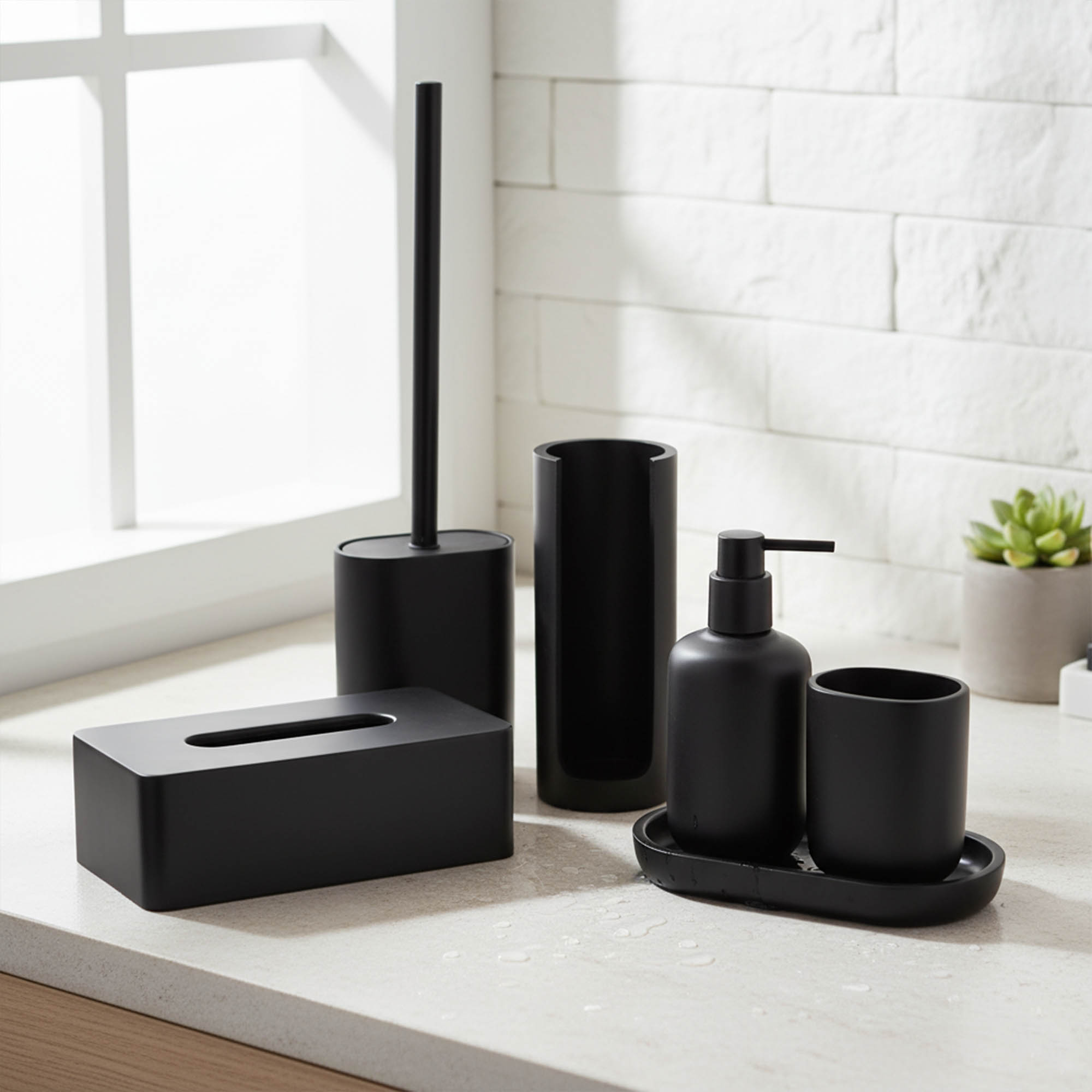 Black bathroom accessories displayed on countertop near window