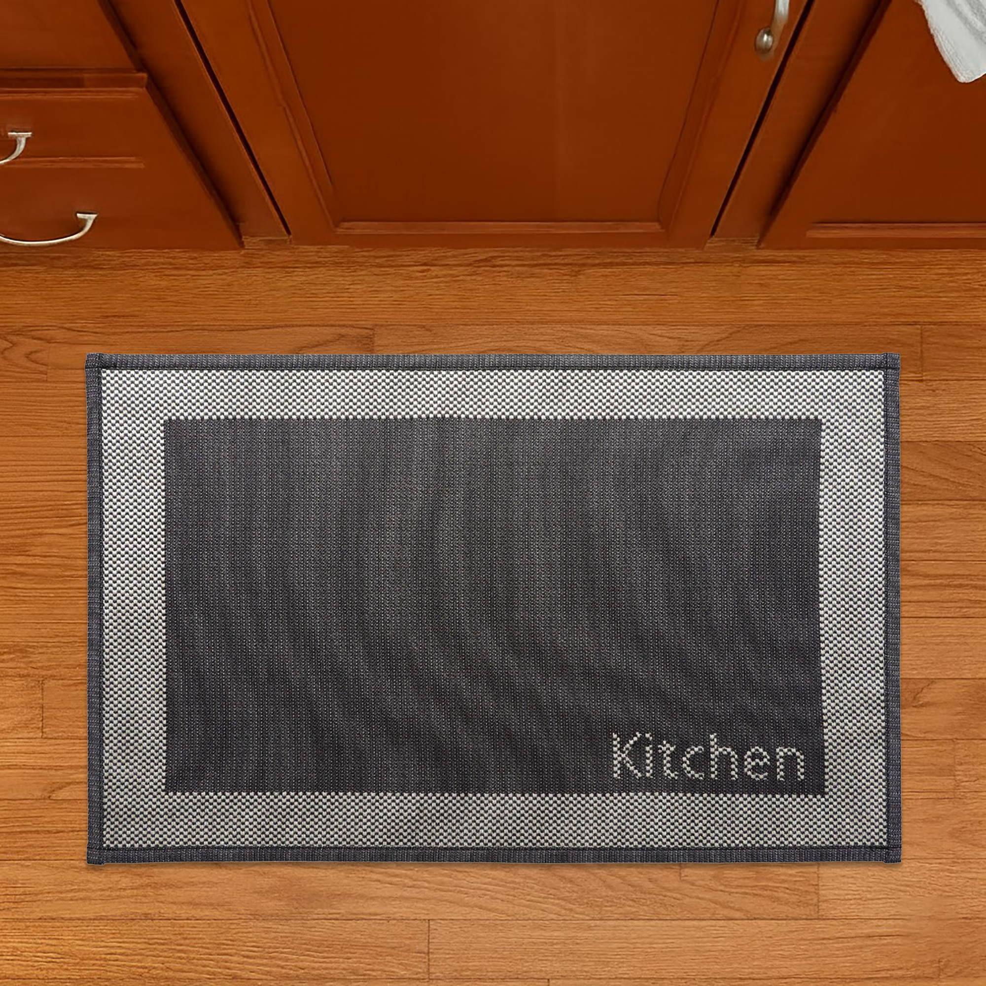 Top view of kitchen mat on wood floor