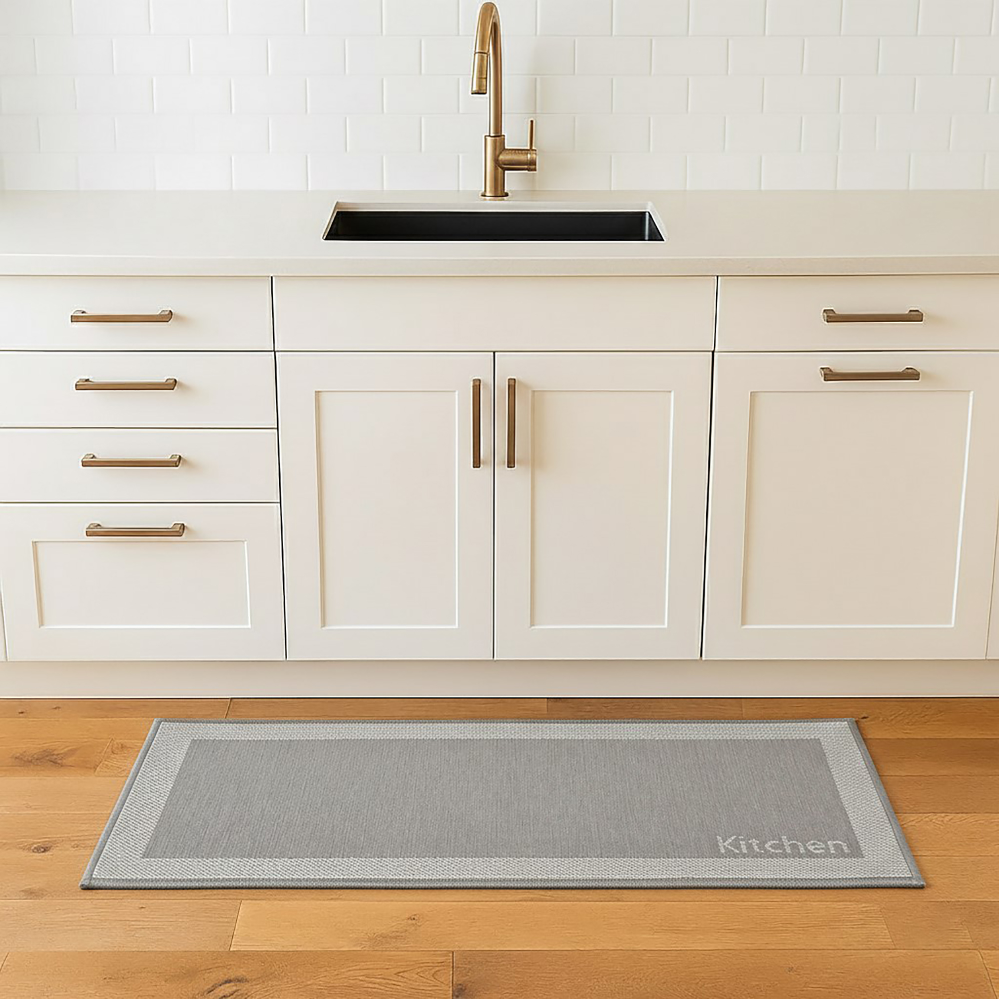 Kitchen beige mat placed in front of farmhouse sink