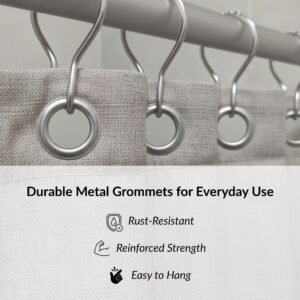 Close-up of metal grommets on taupe shower curtain