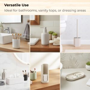 Beige accessories used on vanity and near toilet