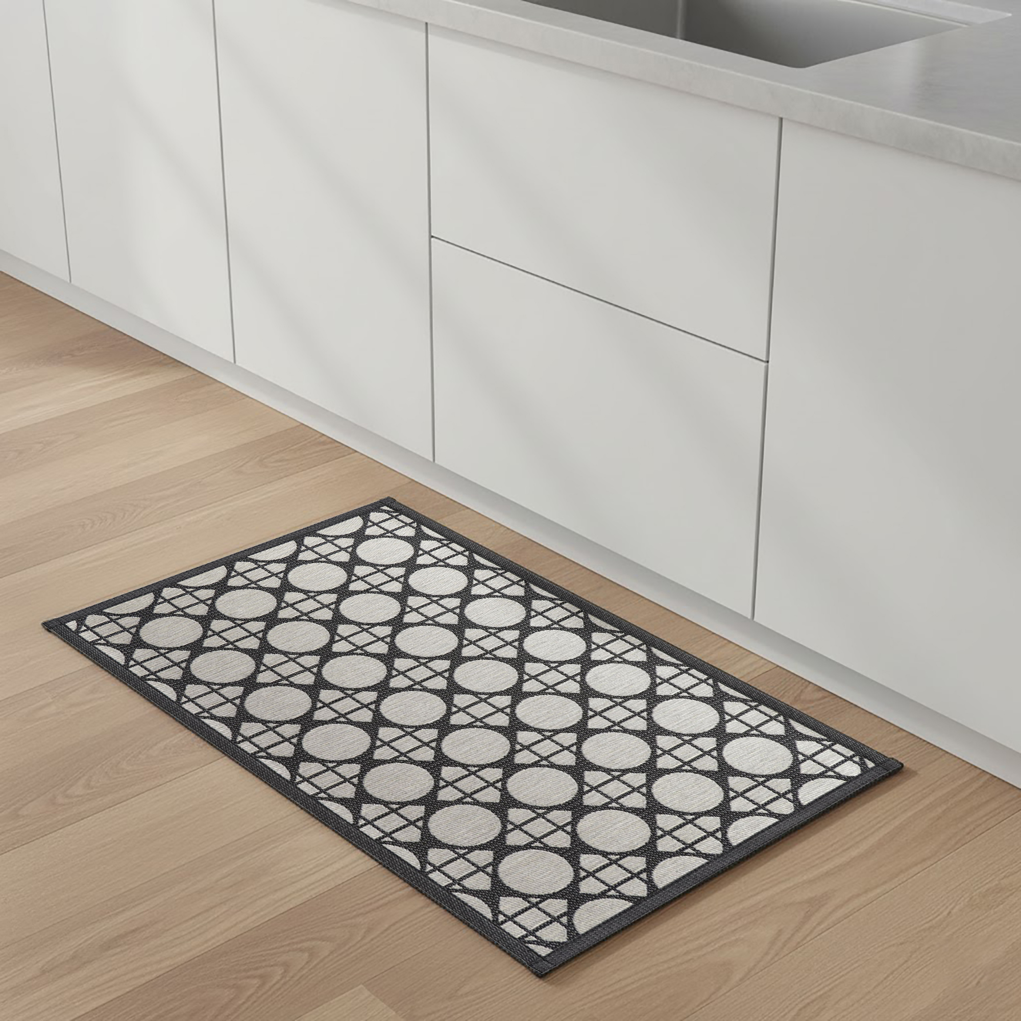 Circles gray kitchen mat in white kitchen setting