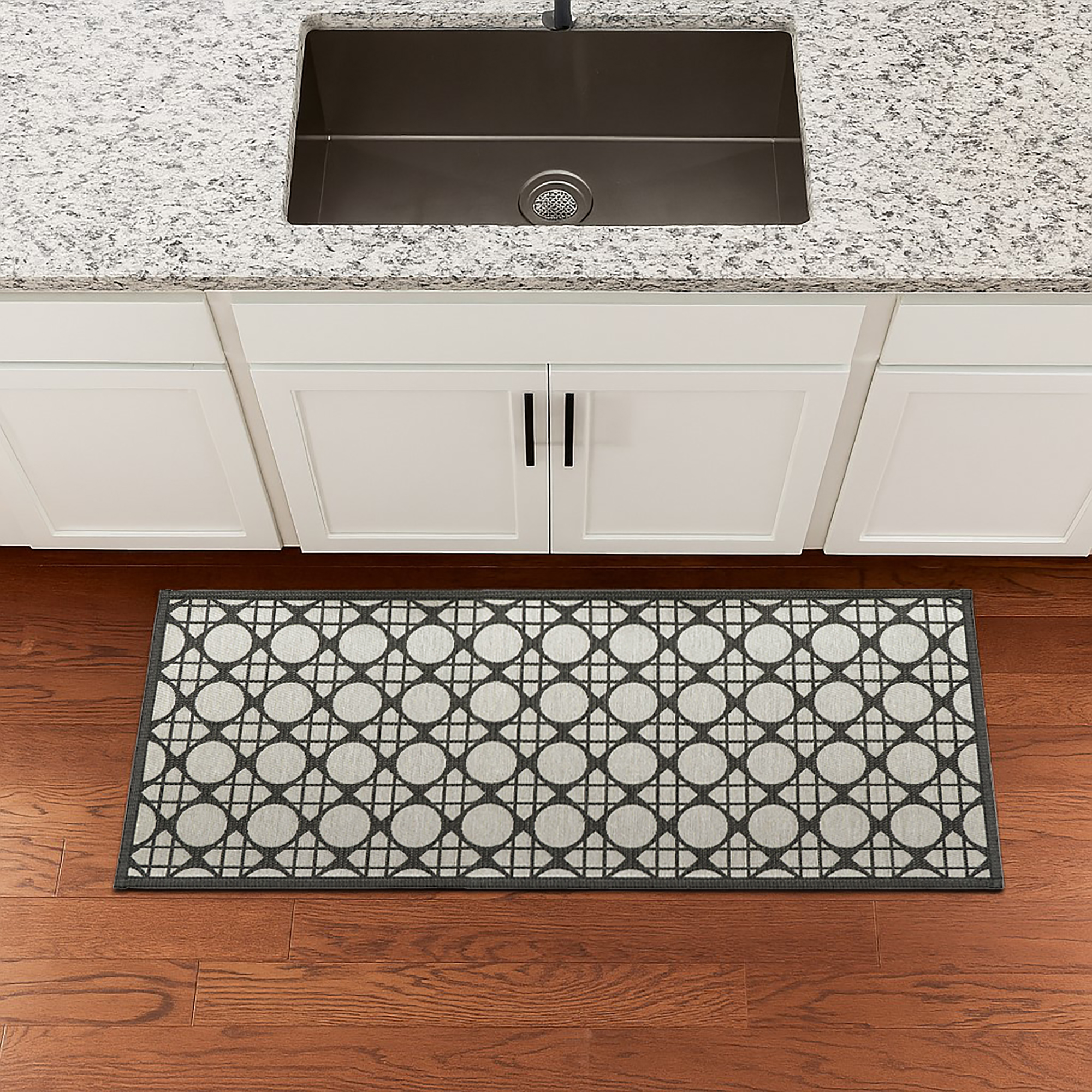 Circles gray kitchen runner styled on warm wooden floor