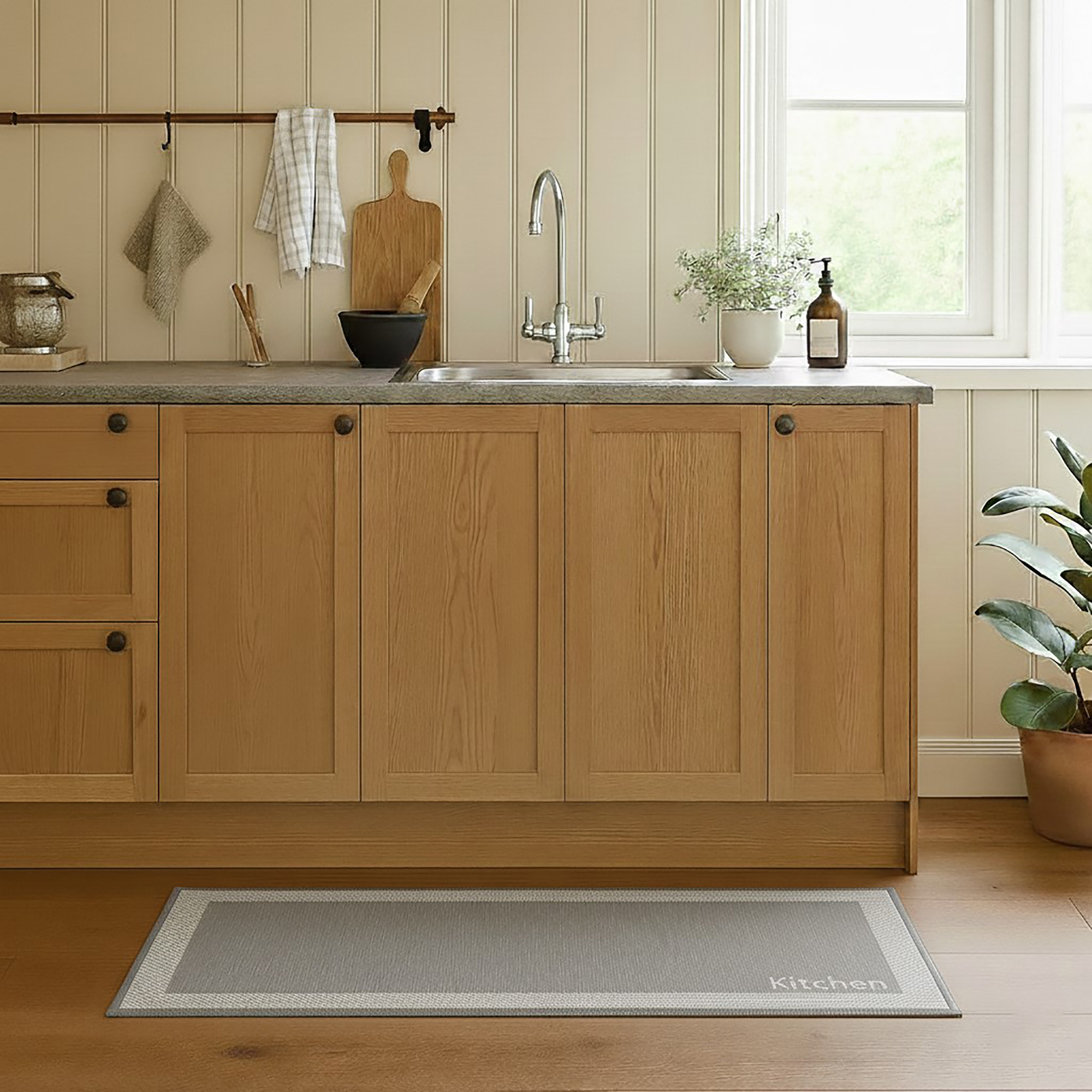 Kitchen beige mat with border in warm wooden kitchen setting