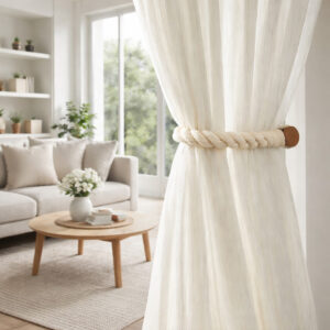 Ecru rope curtain tieback installed on sheer curtain in living room