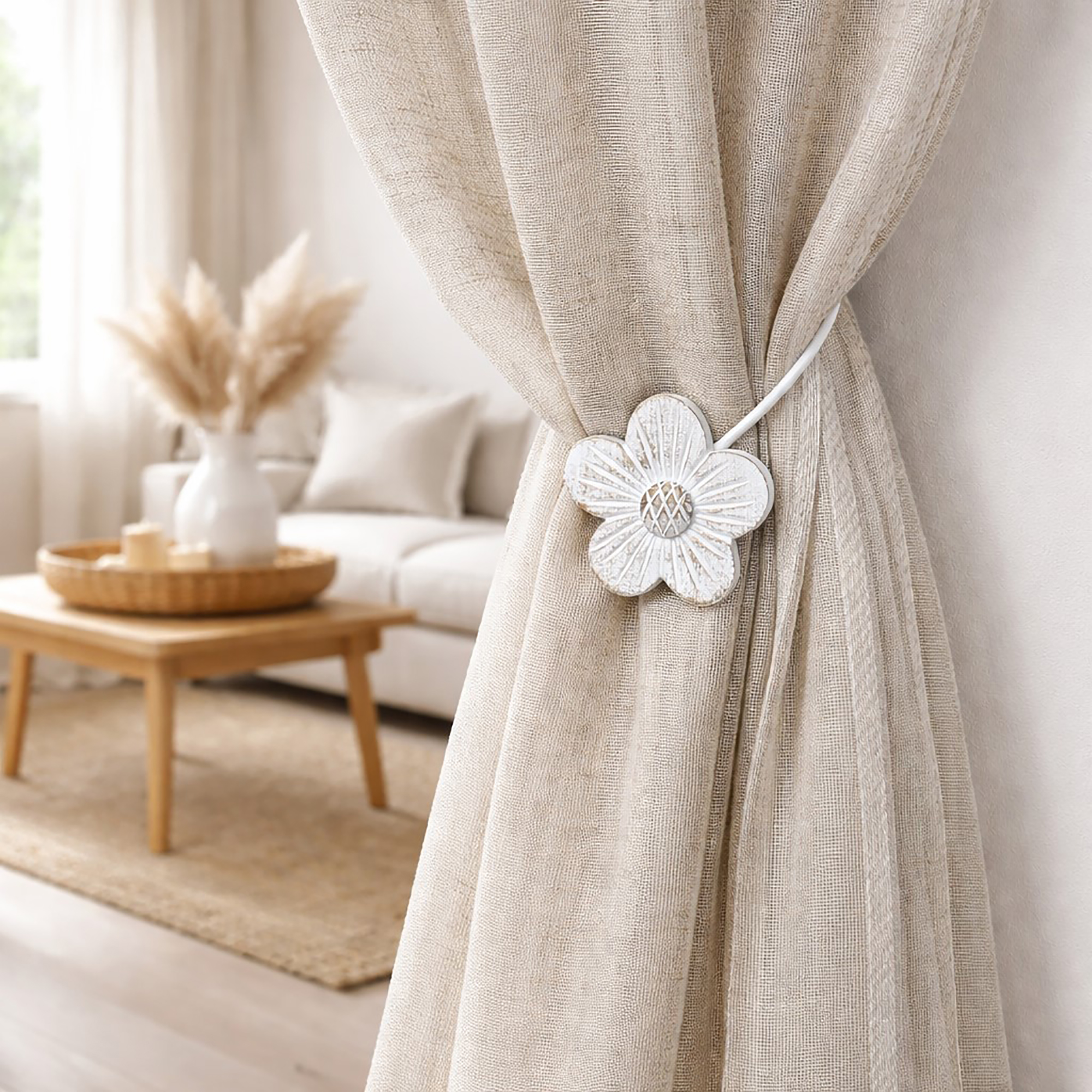 White resin flower tieback holding neutral curtain in living room