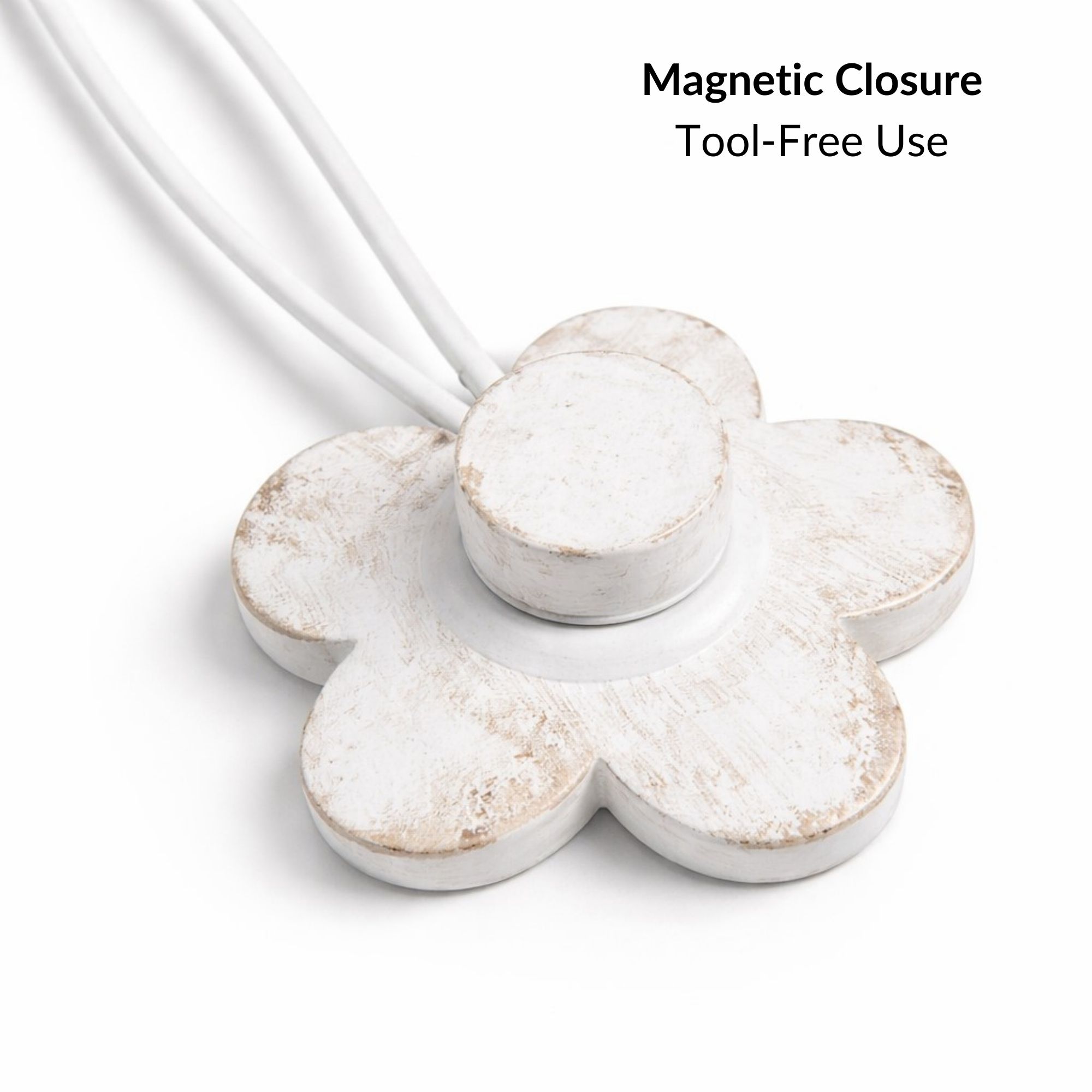 Back view of resin flower tieback showing magnetic closure