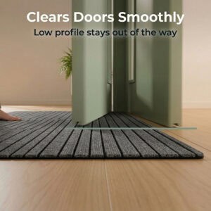 Low profile gray ribbed doormat under swinging green door with clearance line graphic — Clears Doors Smoothly, low profile stays out of the way
