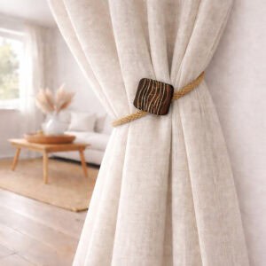 Single rope curtain tieback securing neutral curtain panel