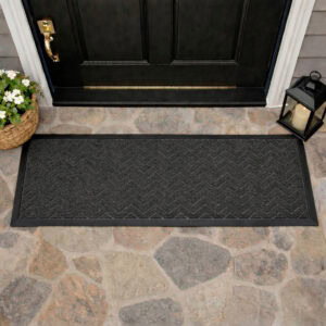 Runner doormat at front door threshold stone floor chevron pattern