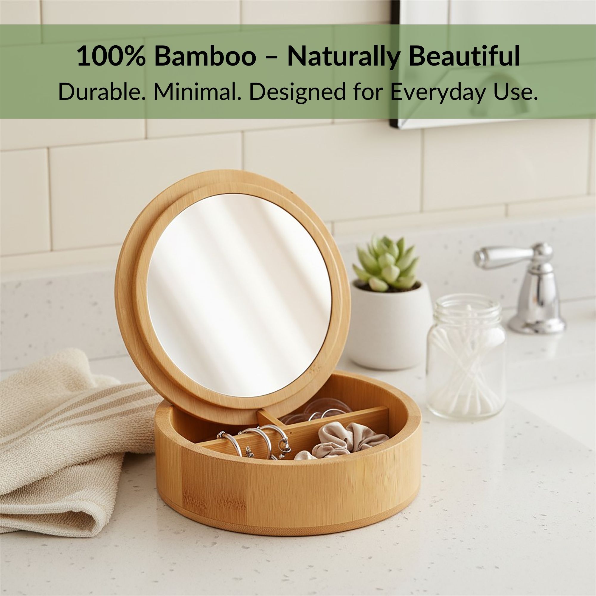 Open bamboo mirror box with jewelry on a bathroom countertop near a faucet