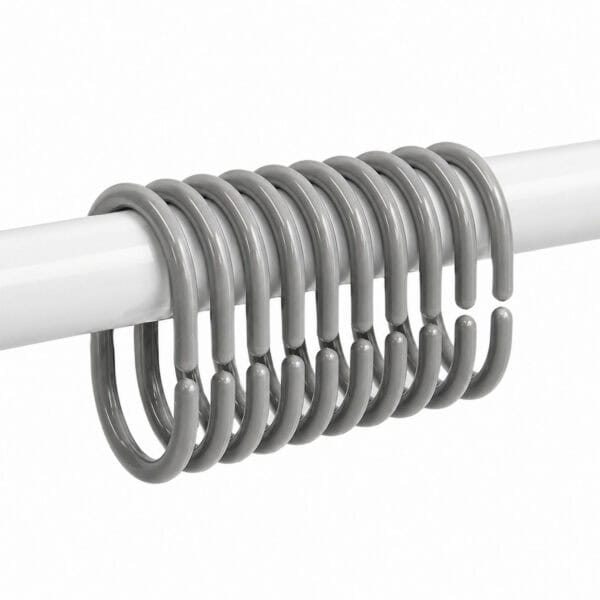 Glossy gray curtain rings grouped on white rod showing full set alignment