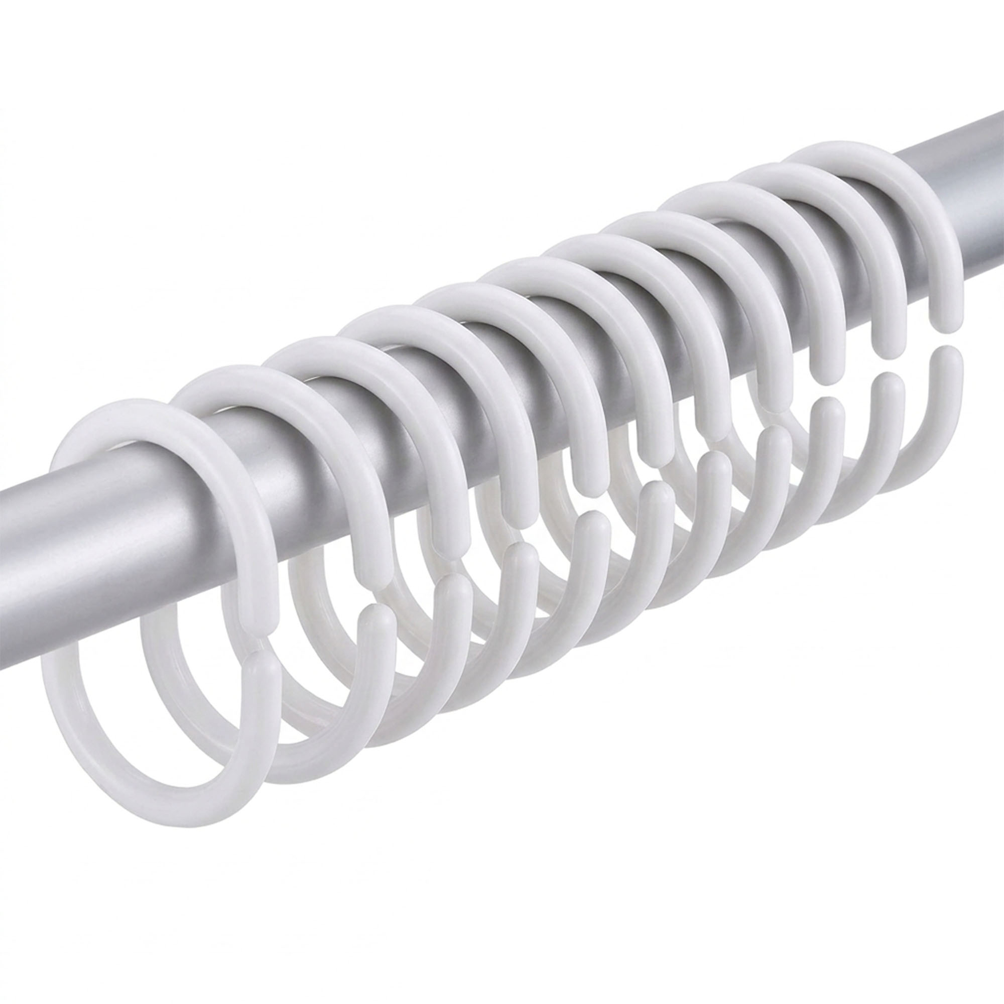 White plastic shower curtain hooks arranged on metal rod showing slim curved shape and smooth finish