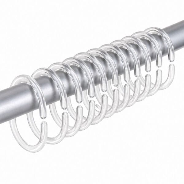 Clear plastic curtain hooks mounted on brushed metal shower rod showing alignment and spacing