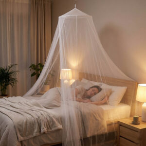 Woman sleeping peacefully inside white dome mosquito net canopy hanging from ceiling in warm bedroom at night