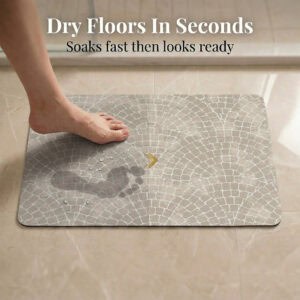 Foot stepping on Mosaic Stone bath mat showing "Dry Floors In Seconds" with water droplets