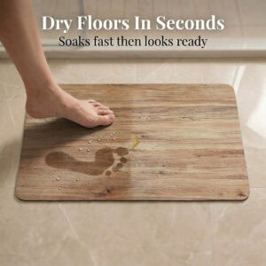 Foot stepping on Oak Wood bath mat showing "Dry Floors In Seconds" with water droplets