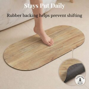 Foot stepping on oval Oak Wood runner mat with rubber backing detail, "Stays Put Daily, Rubber backing helps prevent shifting"