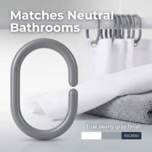 Neutral gray ring placed with towels blending into modern bathroom decor