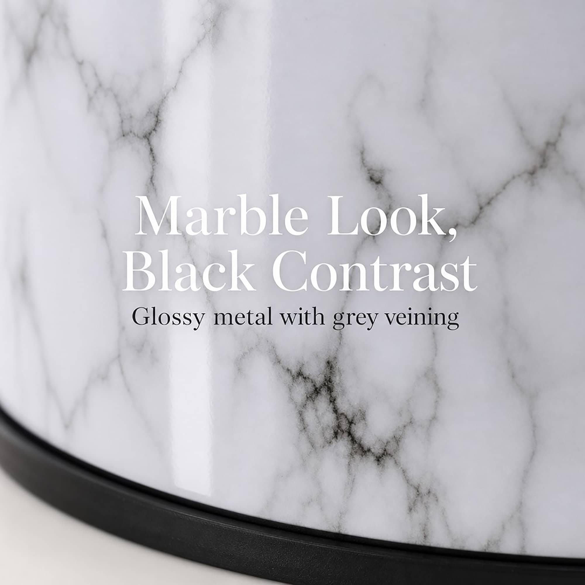 Closeup of the glossy marble look finish with grey veining and matte black trim on the coordinated bathroom set, timeless marble with modern black contrast.