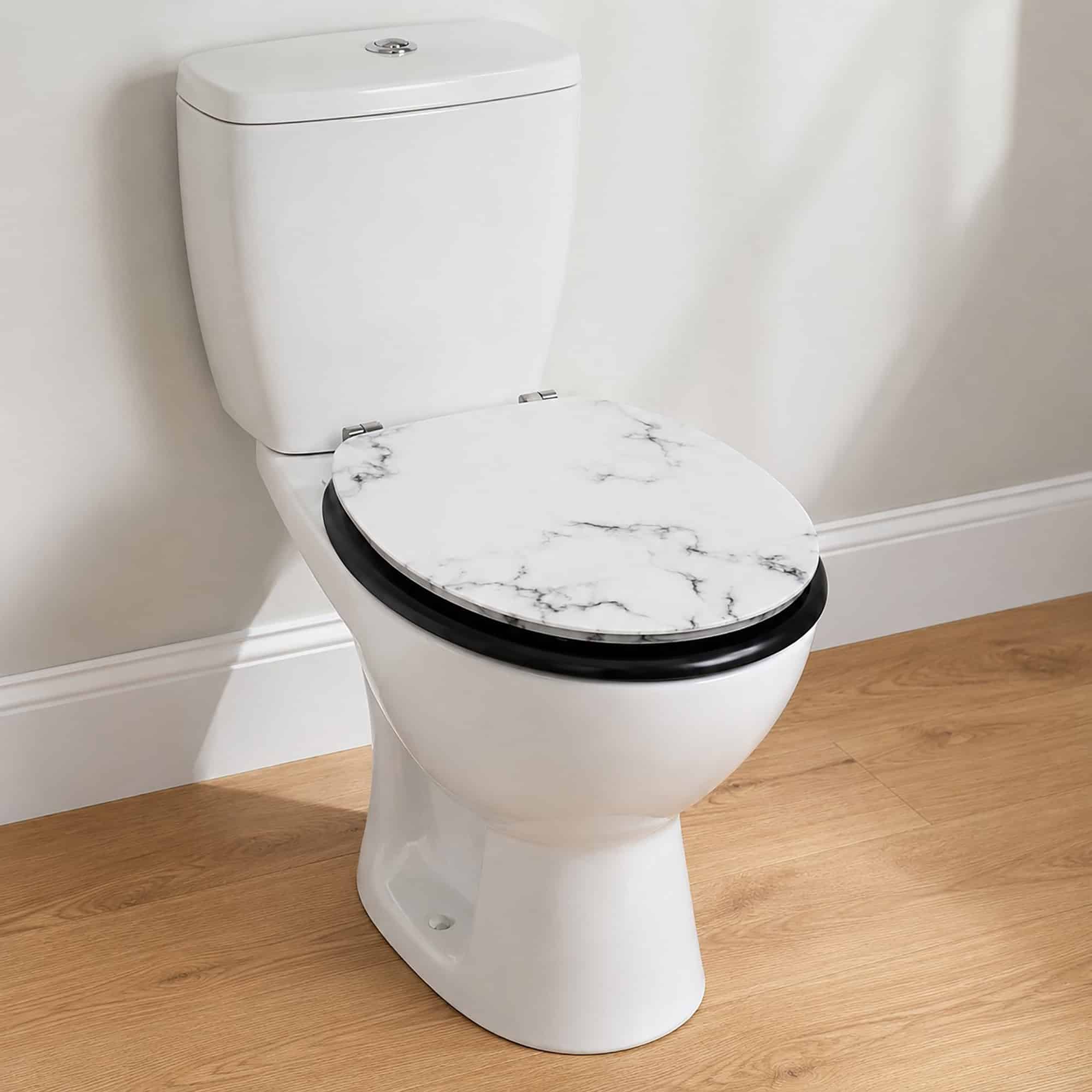 White marble elongated toilet seat with black edge and matte black trim mounted on a white toilet in a bright bathroom with wood flooring.