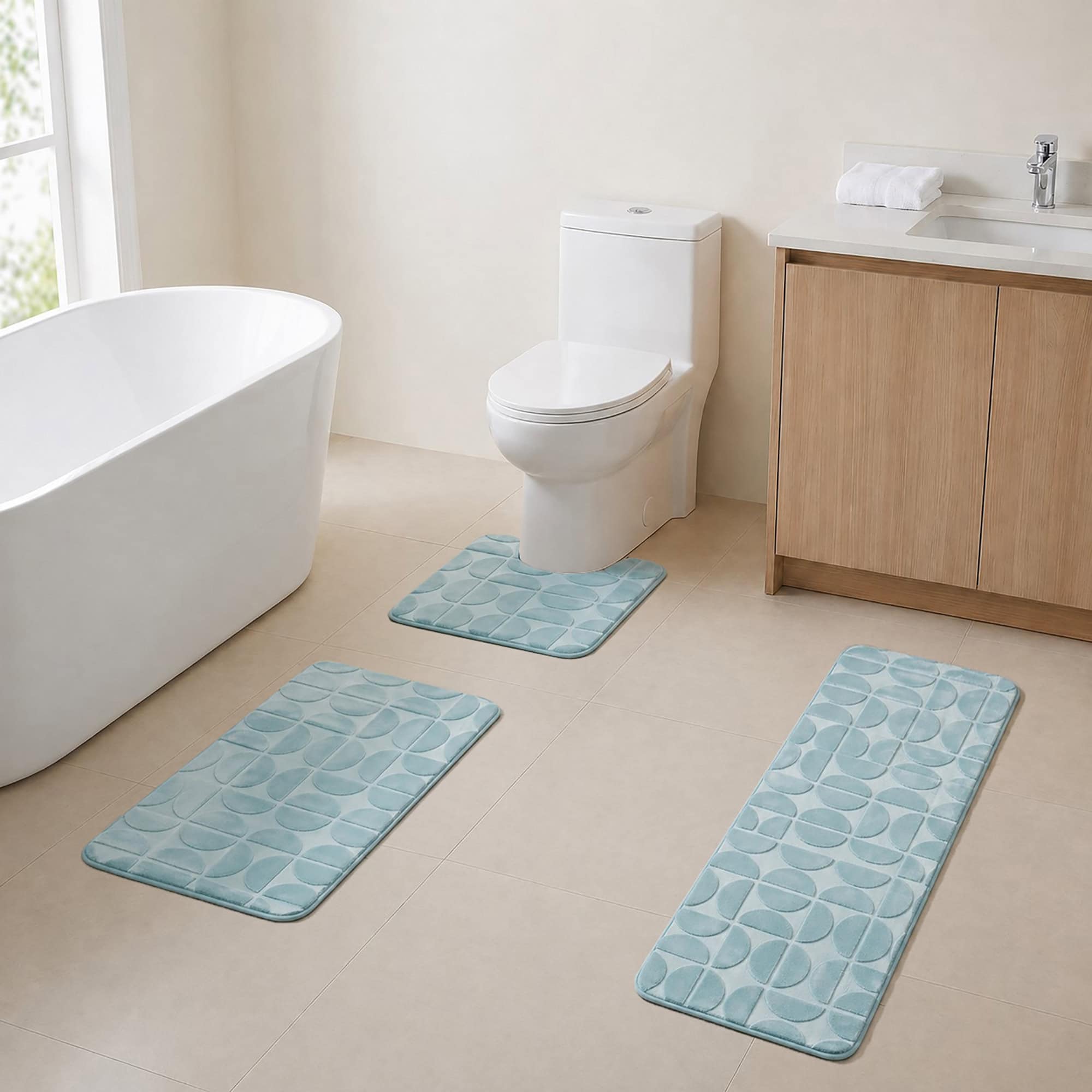 Coordinated blue memory-foam bath rug set in a sunlit bathroom