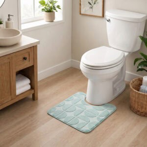 Sage green contour toilet rug displayed in a modern bathroom with warm wood vanity and natural lighting